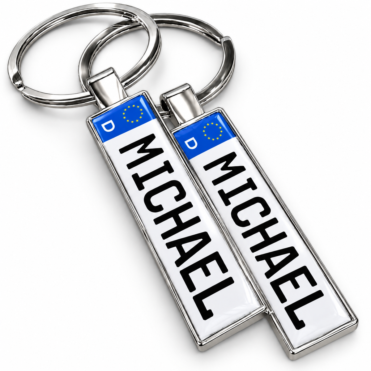 Zwei silberne Schlüsselanhänger aus Metall mit dem Namen MICHAEL
